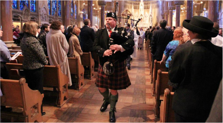 Piper leading funeral from church